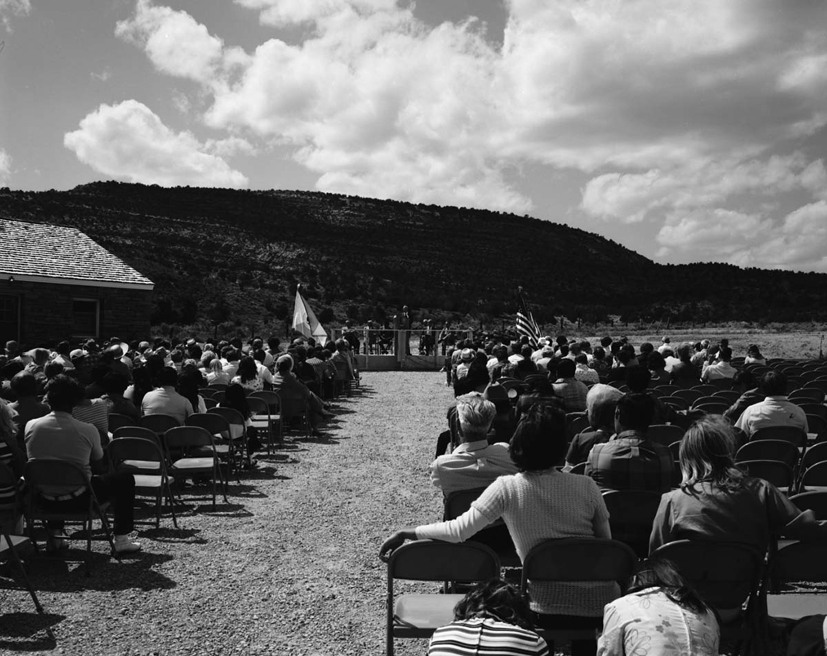 Man addressing visitors at the dedication of new Tribal and National Park Service Visitor Center and 50th anniversary at Pipe Spring National Monument.
