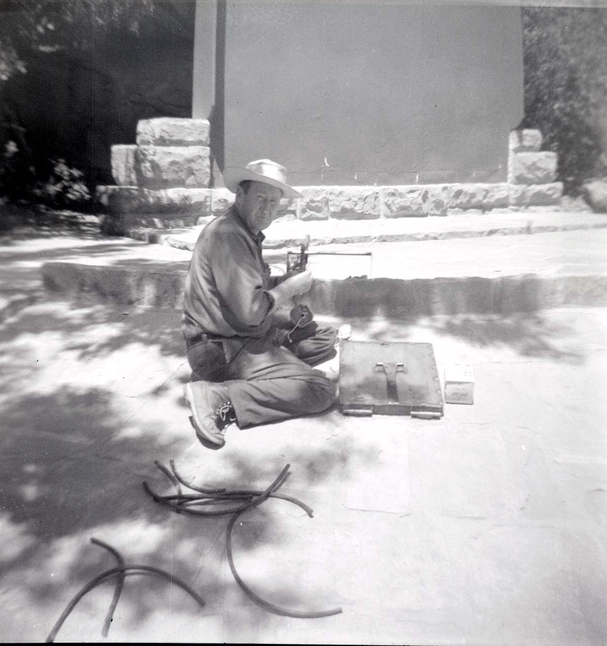 NPS personnel in maintenance yard doing tasks.