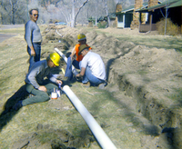 Workers handling piping during the Zion Lodge utilities project.