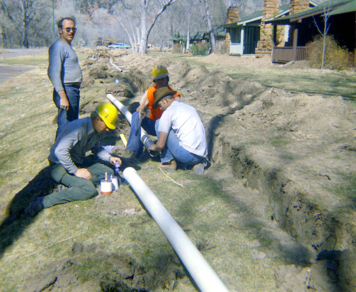 Workers handling piping during the Zion Lodge utilities project.