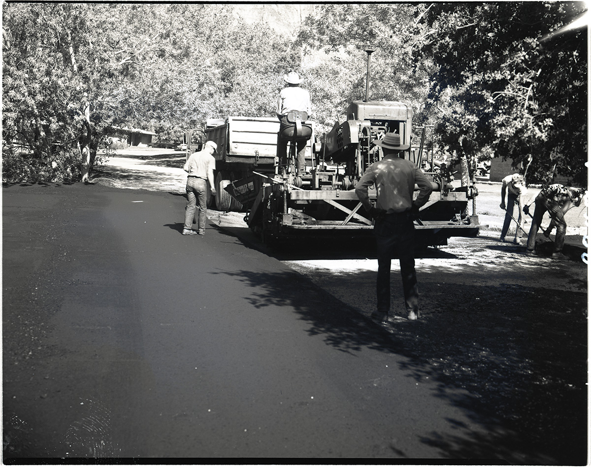 Road repair laying hot mix in Oak Creek area.