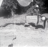 Men lowering rock while doing road work along the scenic canyon drive near the Grotto.