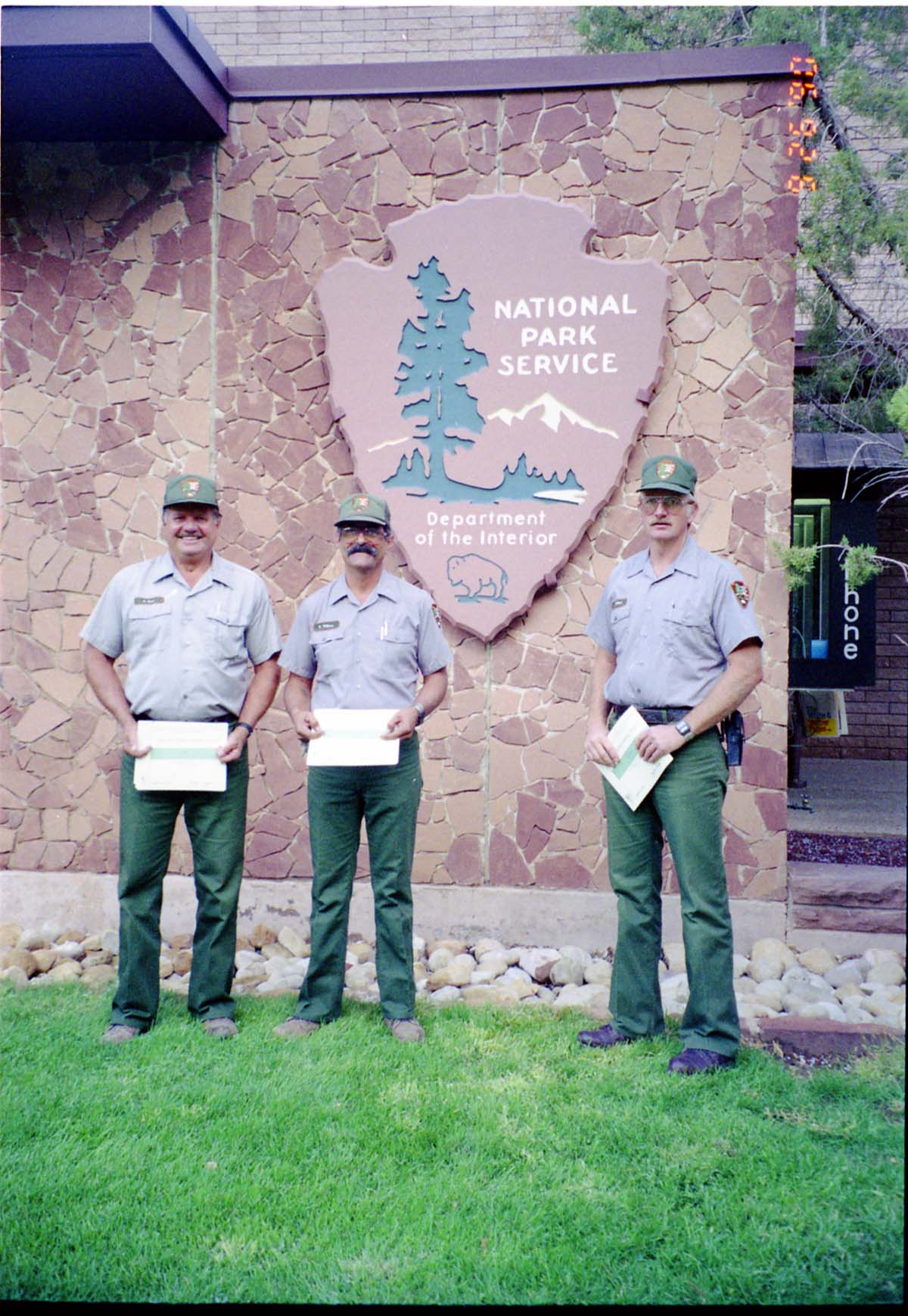 Color Photos of Superintendent Harold Grafe giving out awards to park personnel.