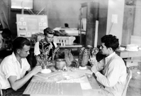 Civilian Conservation Corps (CCC) workers at the Western Museum Laboratory (WML) preparing cacti reproductions for diorama - wax with either bristle spines or real spines gathered from desert. Every species in Zion has been duplicated. [Image is identical to ZION 10363.]