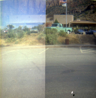 Vehicles parked in the parking lot of the old Mission 66 Visitor Center and Museum.