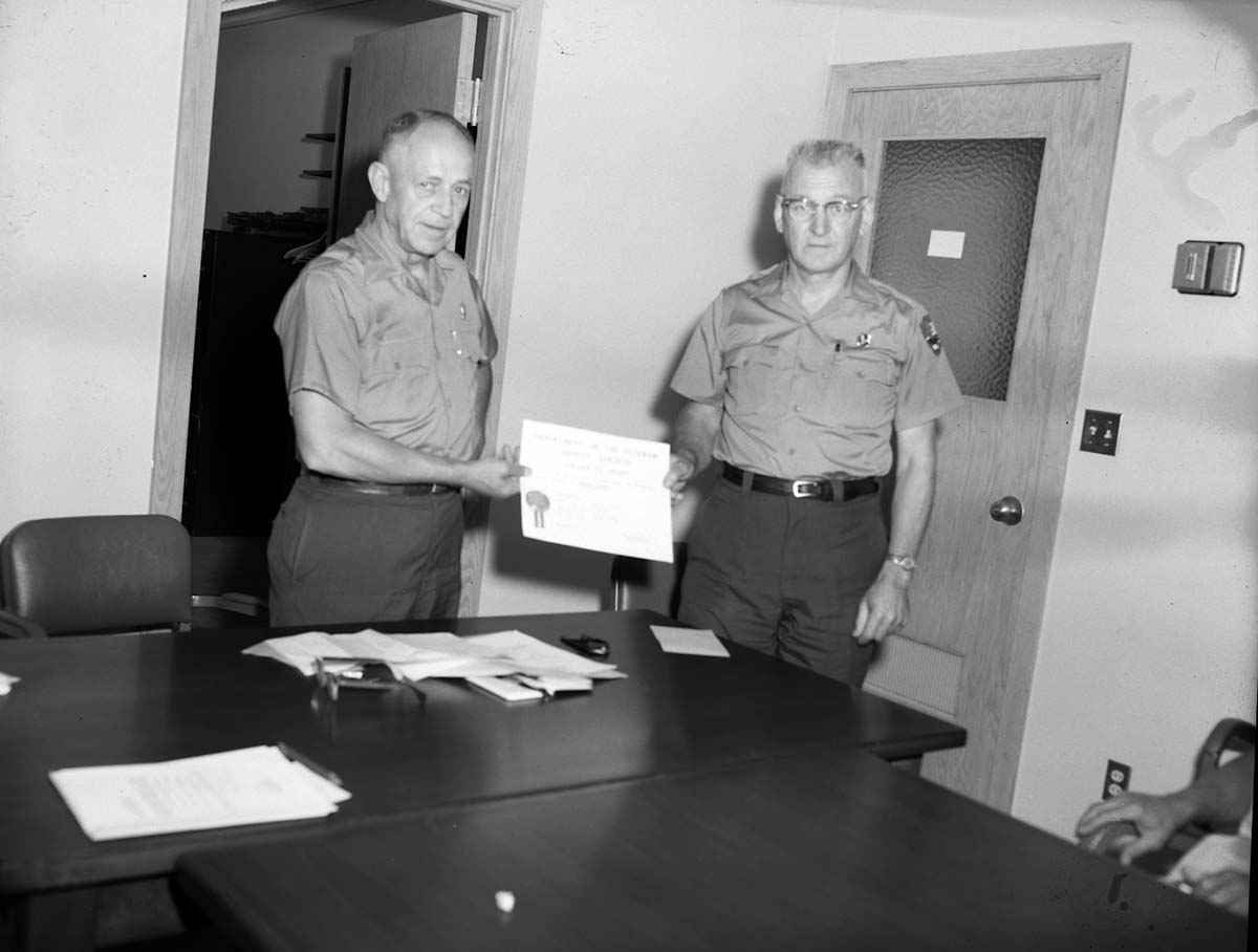 Superintendent Oberhansley presents Assistant Superintendent Charles Humberger with a departmental special citation for outstanding service in the field of safety.