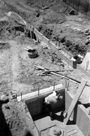 Man working on wall during the construction of headquarters addition.
