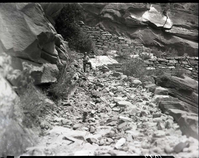 Damage done by storm of July 25, 1954 to West Rim Trail. Approximately halfway down switchbacks leading up to Refrigerator Canyon.