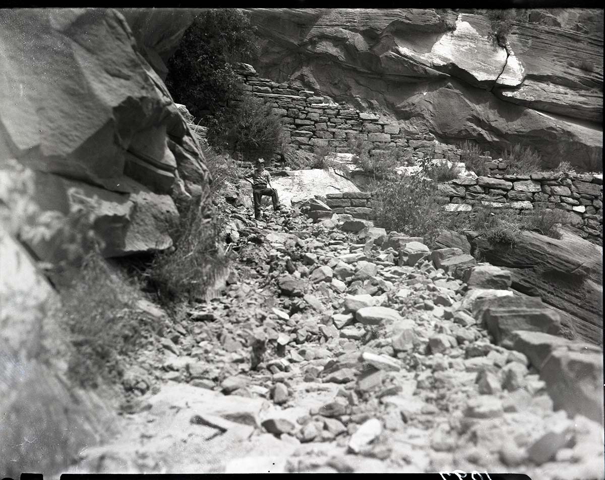 Damage done by storm of July 25, 1954 to West Rim Trail. Approximately halfway down switchbacks leading up to Refrigerator Canyon.