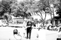 Crowd watching as Arizona Governor Jack Williams and 'Miss Fredonia' cut the ribbon at the dedication ceremony of Arizona State Highway 389, Fredonia, Arizona, August 5, 1967.