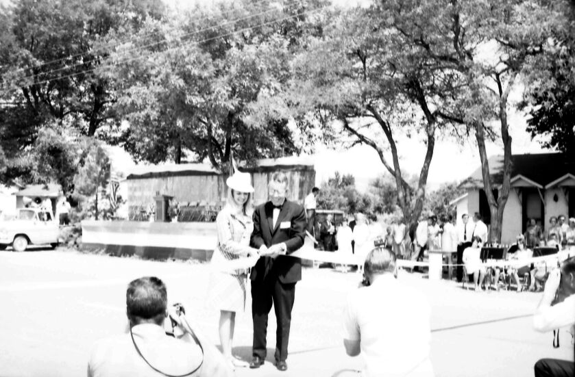 Crowd watching as Arizona Governor Jack Williams and 'Miss Fredonia' cut the ribbon at the dedication ceremony of Arizona State Highway 389, Fredonia, Arizona, August 5, 1967.