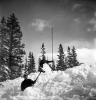 BW Photos showing rangers digging out the visitor center from snowdrift.