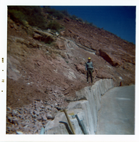 Man helping construct the slide control wall along Kolob Canyon Road.