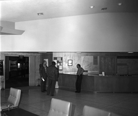 Visitors viewing the interpretive display in the old Mission 66 Visitor Center and Museum.