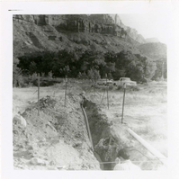 Workers digging ditch during the Watchman housing utility project.