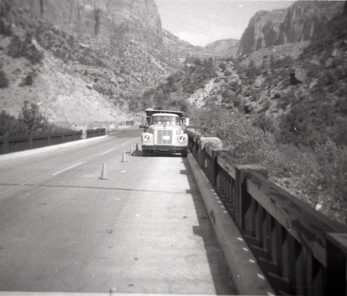 Car parked on Canyon Junction vehicle bridge during construction.