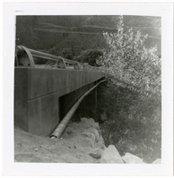 Piping system on underside of bridge during the Watchman housing utility project.