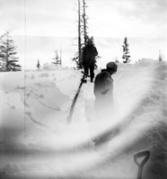BW Photos showing rangers digging out the visitor center from snowdrift.