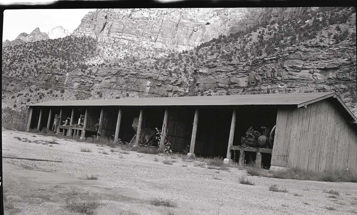 Overflow warehouse, old Civilian Conservation Corps (CCC) site with equipment.