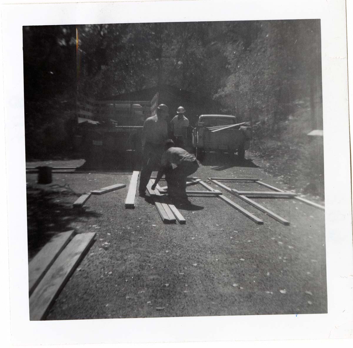 Construction activity - preparing lumber/scaffolding.