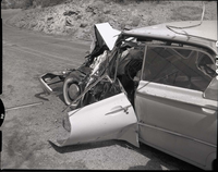 Collision between private car (Ford) towing U-Haul trailer and (Utah Parks Company) bus.