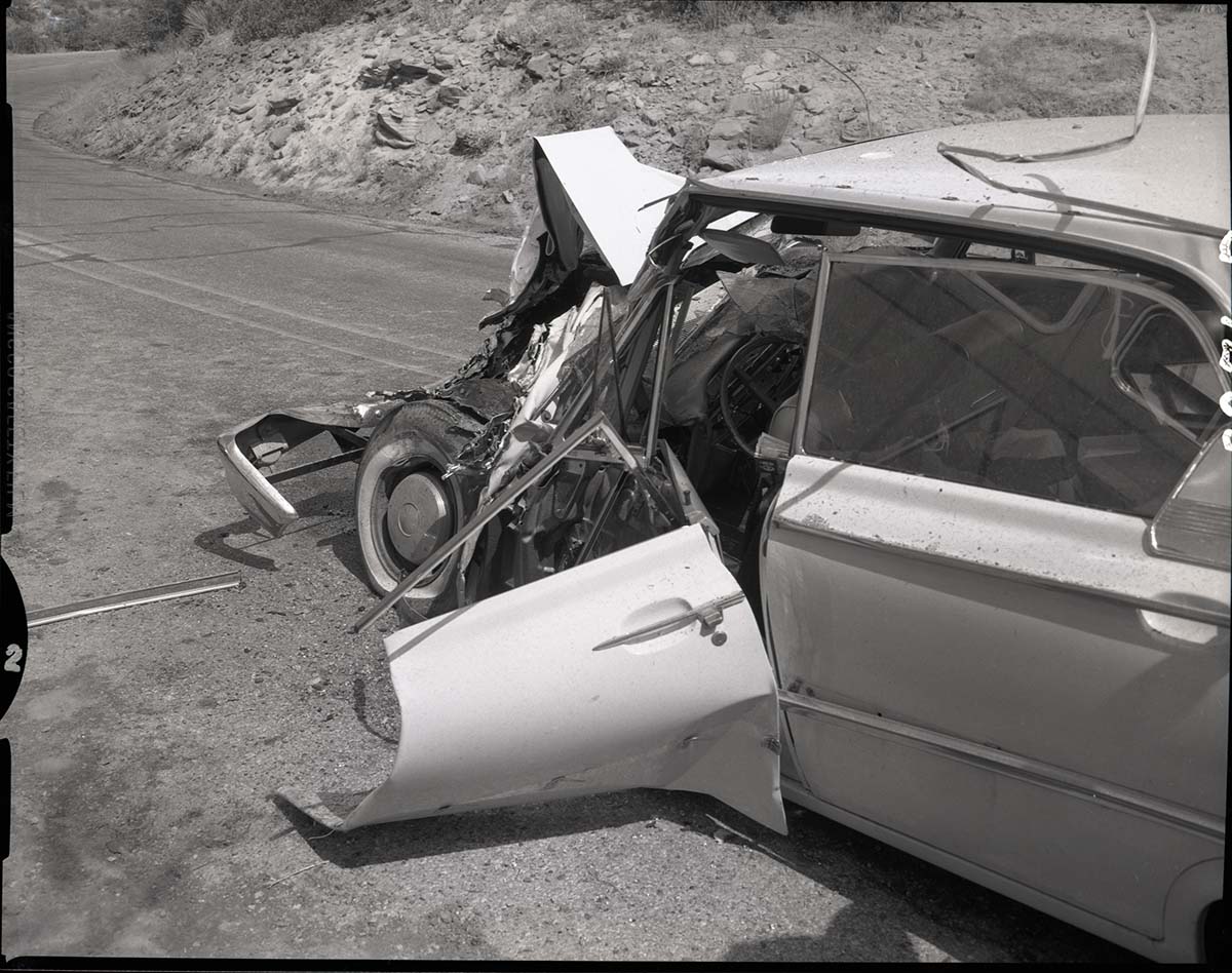 Collision between private car (Ford) towing U-Haul trailer and (Utah Parks Company) bus.
