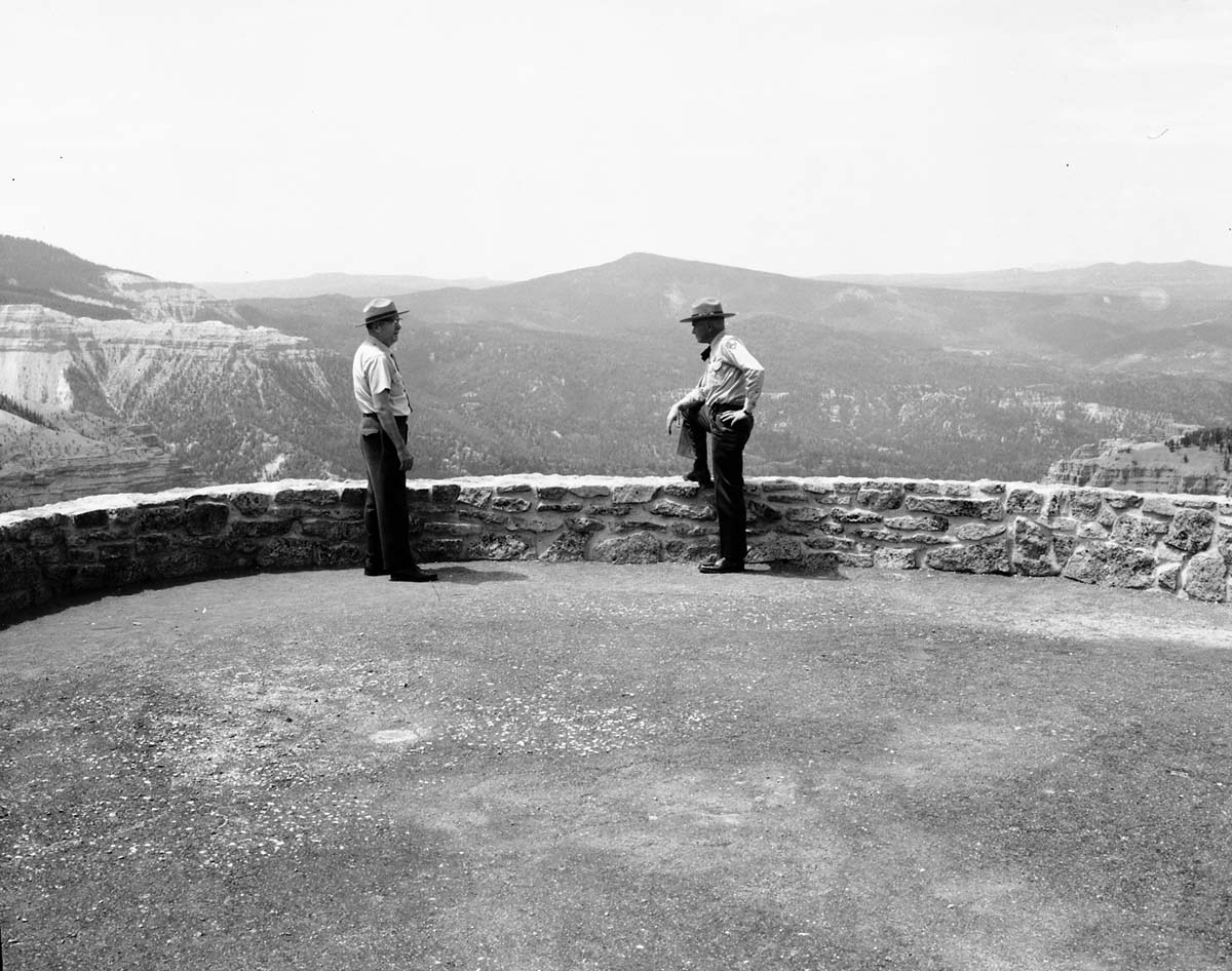 Carl E. Jepson and man standing at site selected for message repeater, Chessman Ridge Overlook and north view.