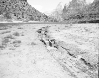 Flood damage - washed out terrace dam of irrigation system.