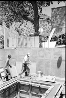 Workers during the construction of headquarters addition.