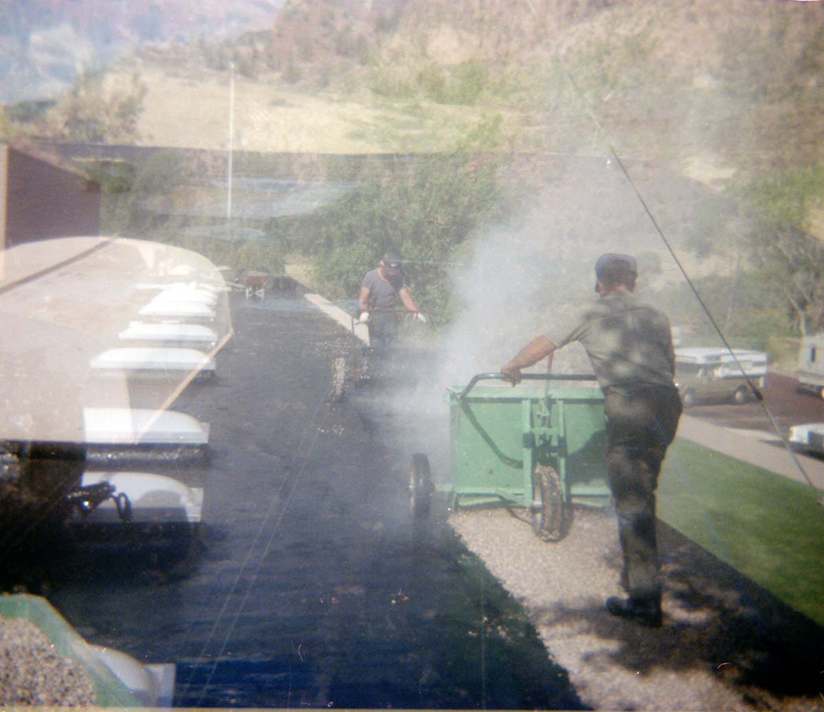 Man operating roofing machine during the headquarters/visitor center roofing project.
