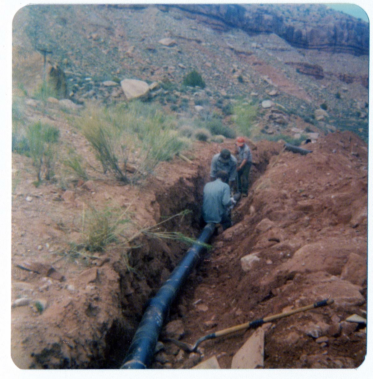 Men working on the construction of the Springdale water pipeline.