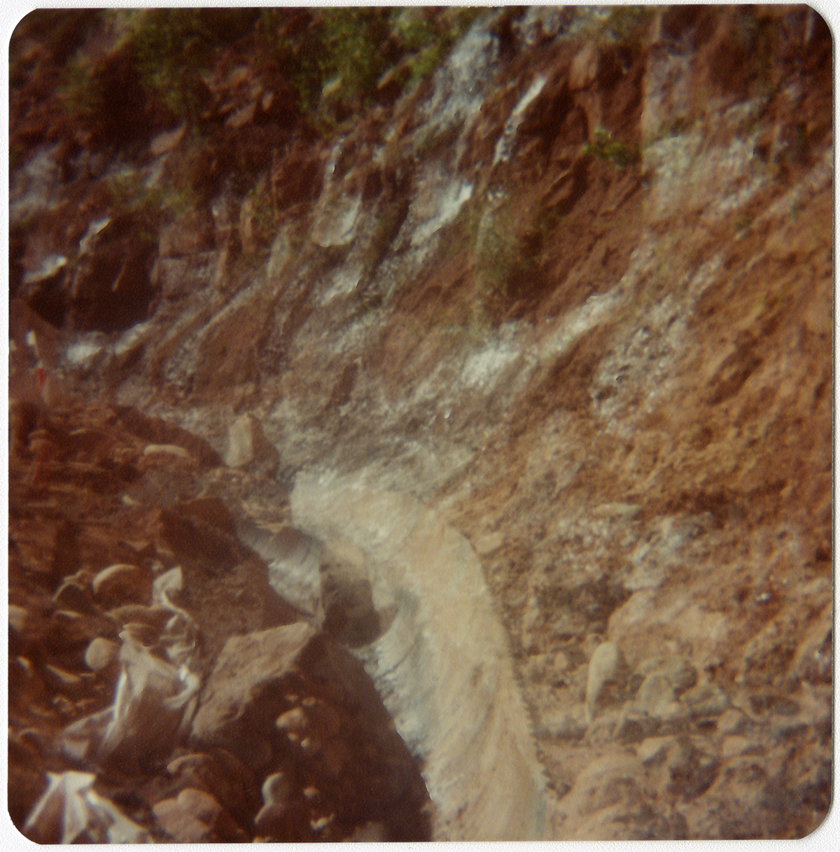 Rocky side of mountain with trench during road repair of Kolob Canyon Road.