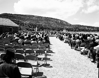 Man addressing visitors at the dedication of new Tribal and National Park Service Visitor Center and 50th anniversary at Pipe Spring National Monument.