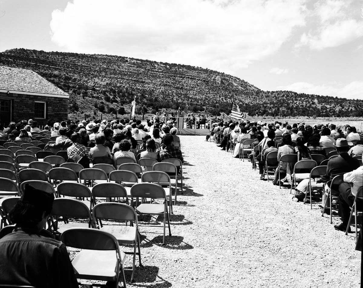 Man addressing visitors at the dedication of new Tribal and National Park Service Visitor Center and 50th anniversary at Pipe Spring National Monument.