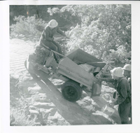 Workers operating construction equipment during the West Rim trail half tunnel maintenance/stabilization.