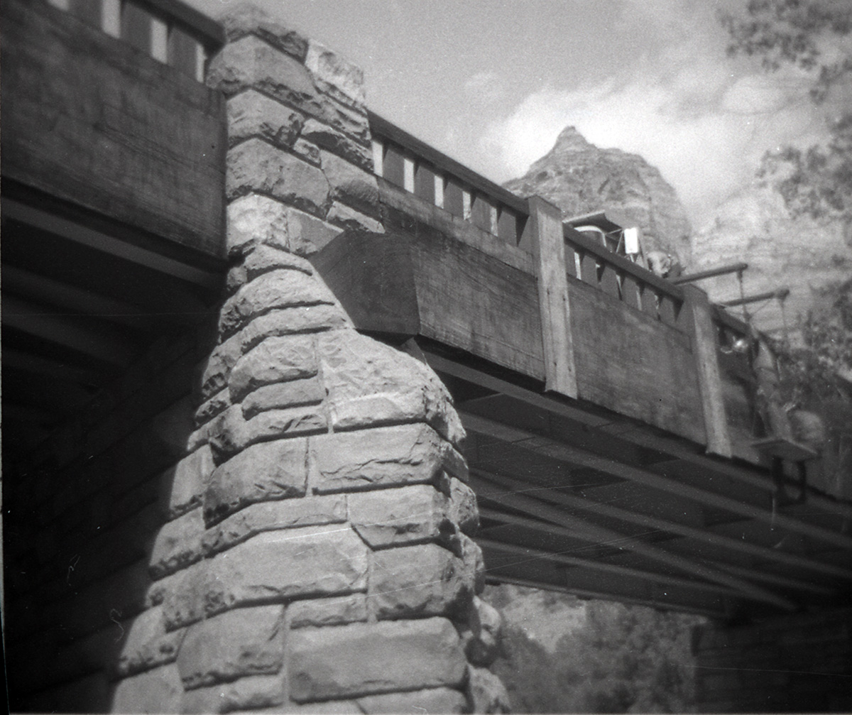 Canyon Junction vehicle bridge with men working on railing.