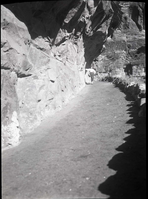 West Rim Trail in 'half tunnel' section after reconstruction and paving, section just below mouth of Refrigerator Canyon.