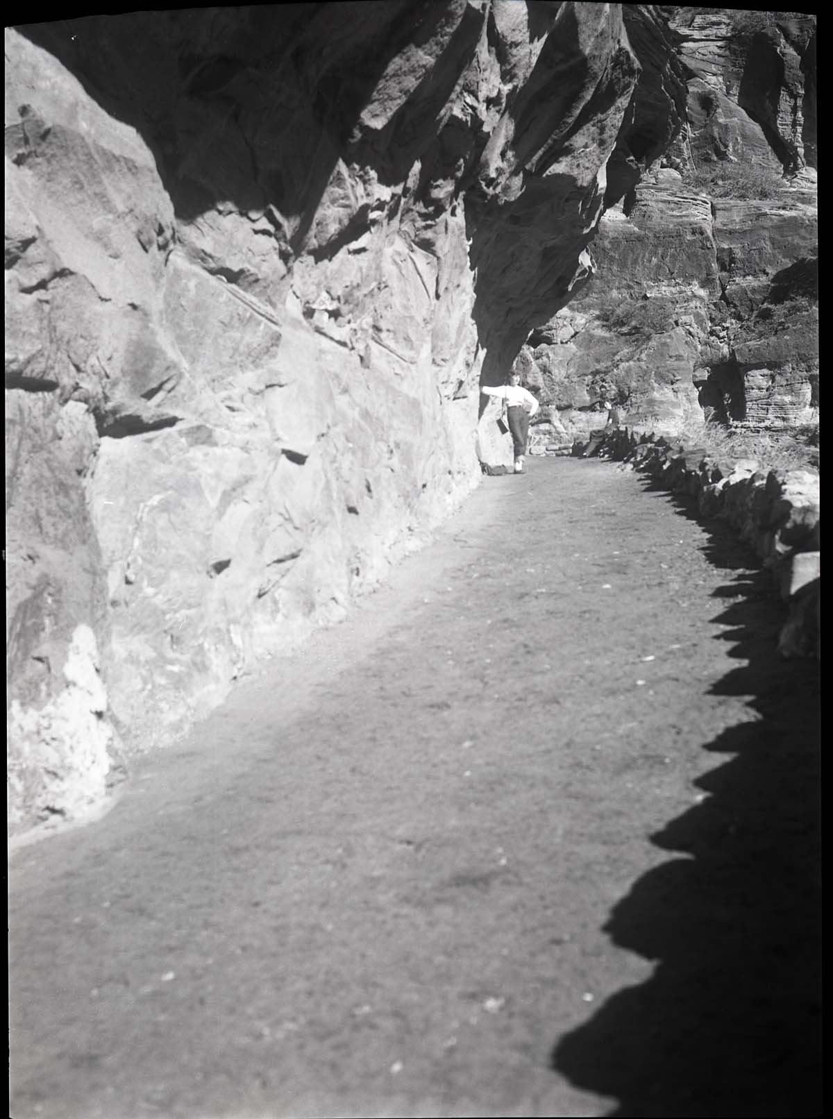 West Rim Trail in 'half tunnel' section after reconstruction and paving, section just below mouth of Refrigerator Canyon.
