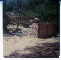 Men working on the emplacement of the new Zion Lodge footbridge.