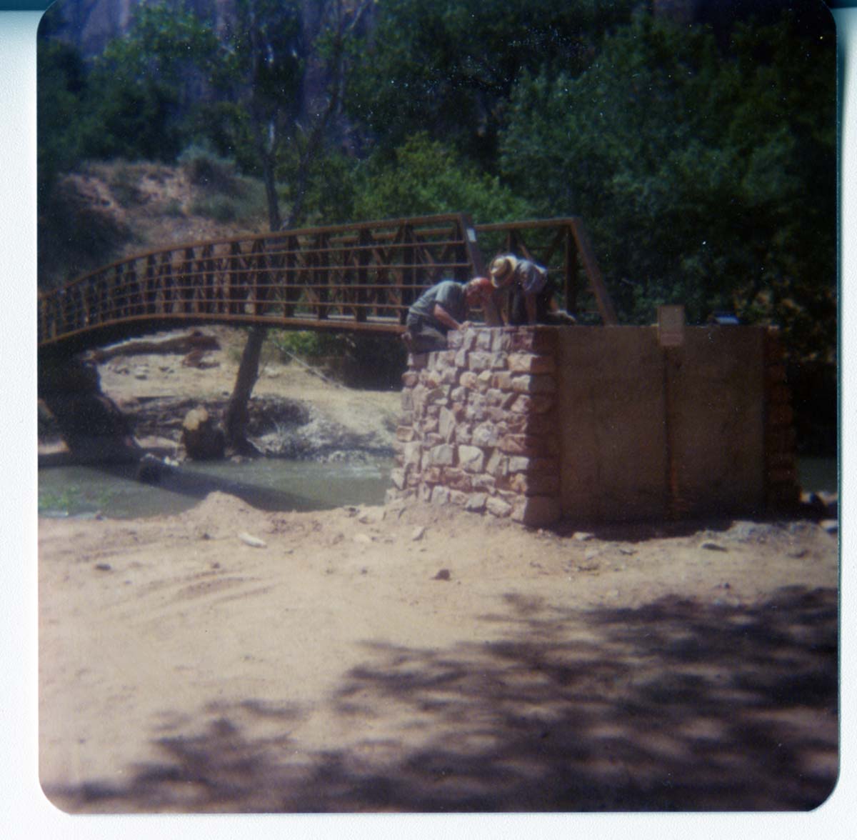 Men working on the emplacement of the new Zion Lodge footbridge.