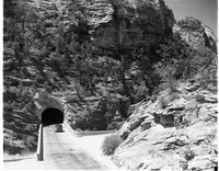 East end of Zion-Mt. Carmel tunnel from Pine Creek crossing. Two vehicles near tunnel.