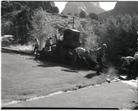 Road repair and laying hot mix in Oak Creek area.