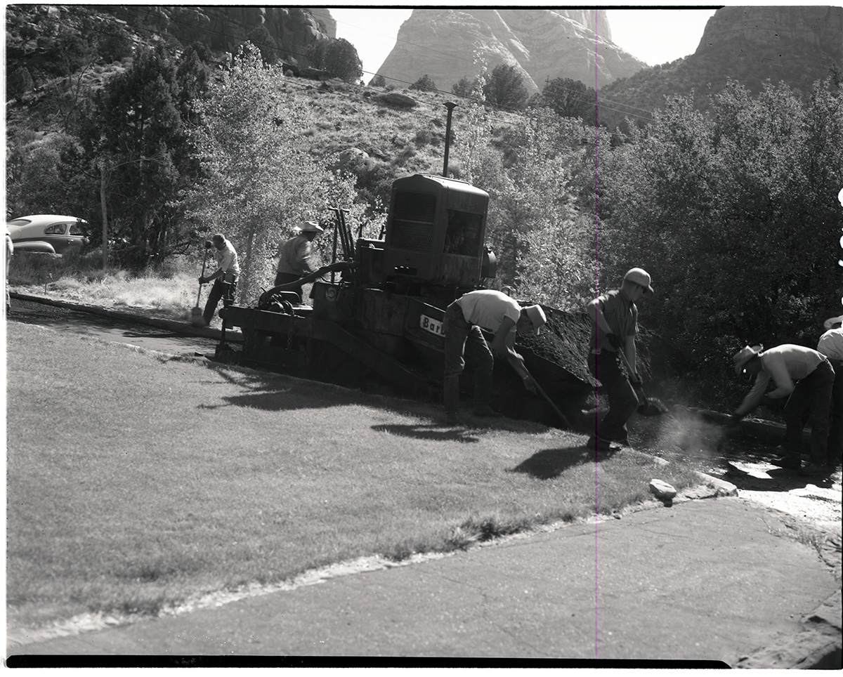 Road repair and laying hot mix in Oak Creek area.