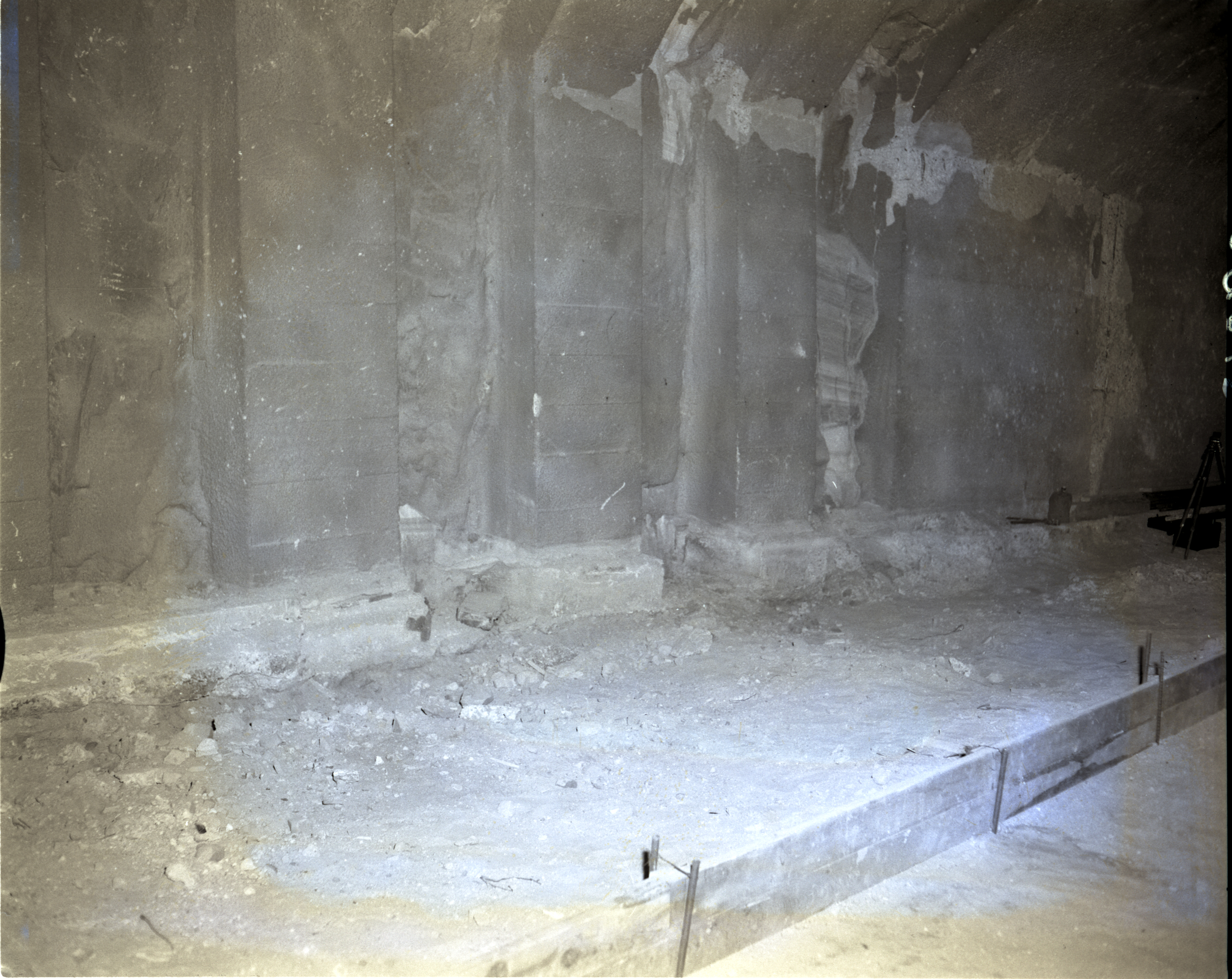 Shattered condition of tunnel wall, illustrating need for repair and danger of work of removing debris from footings.