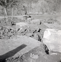 Man clearing the path of rocks and boulders during construction of the Great White Throne parking area.