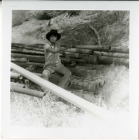 Navajo worker sitting during the utility project at Watchman housing.