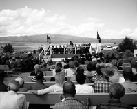 Warren F. Hamilton, Superintendent of Zion National Park, addressing visitors from podium at dedication of Taylor Creek road (Kolob Canyons).