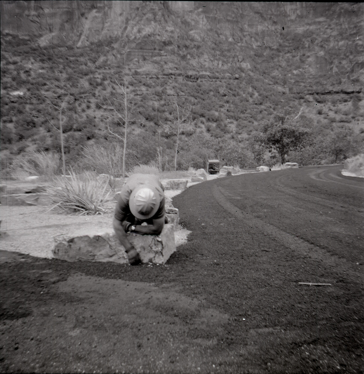 Man working on the road at the Great White Throne parking area.