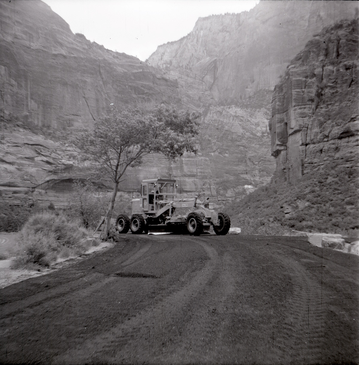 Tractor performing road work on the Great White Throne parking area.