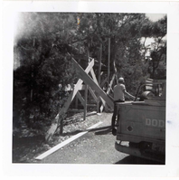 Construction activity - preparing lumber/scaffolding.